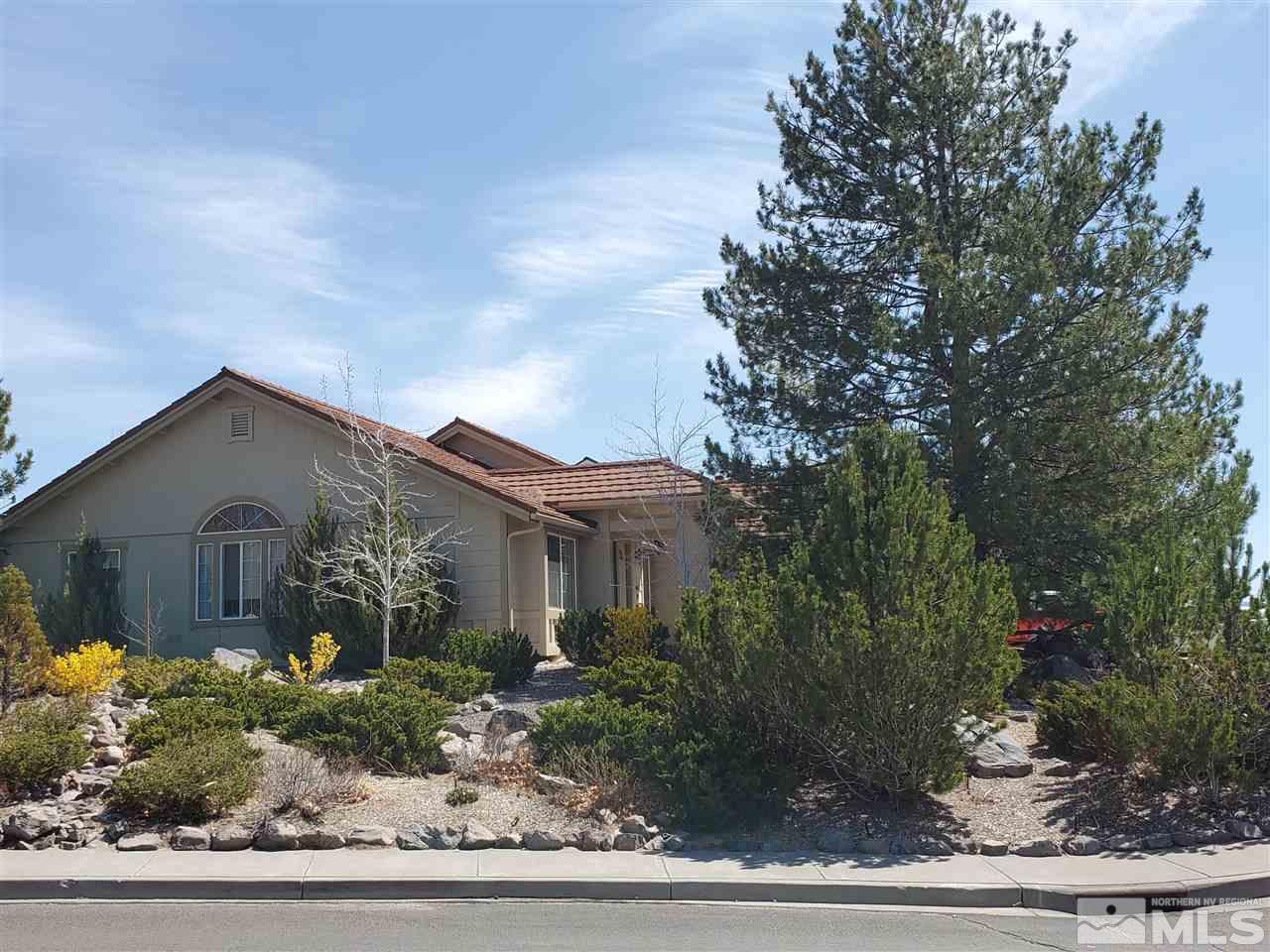 5299 Simons Drive Reno, NV 89523 - Photo 1 of 29 a front view of a house with trees