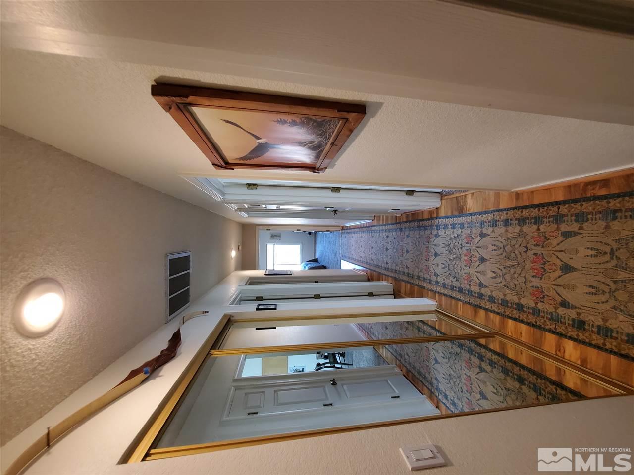5299 Simons Drive Reno, NV 89523 - Photo 16 of 29 a view of hallway with wooden floor