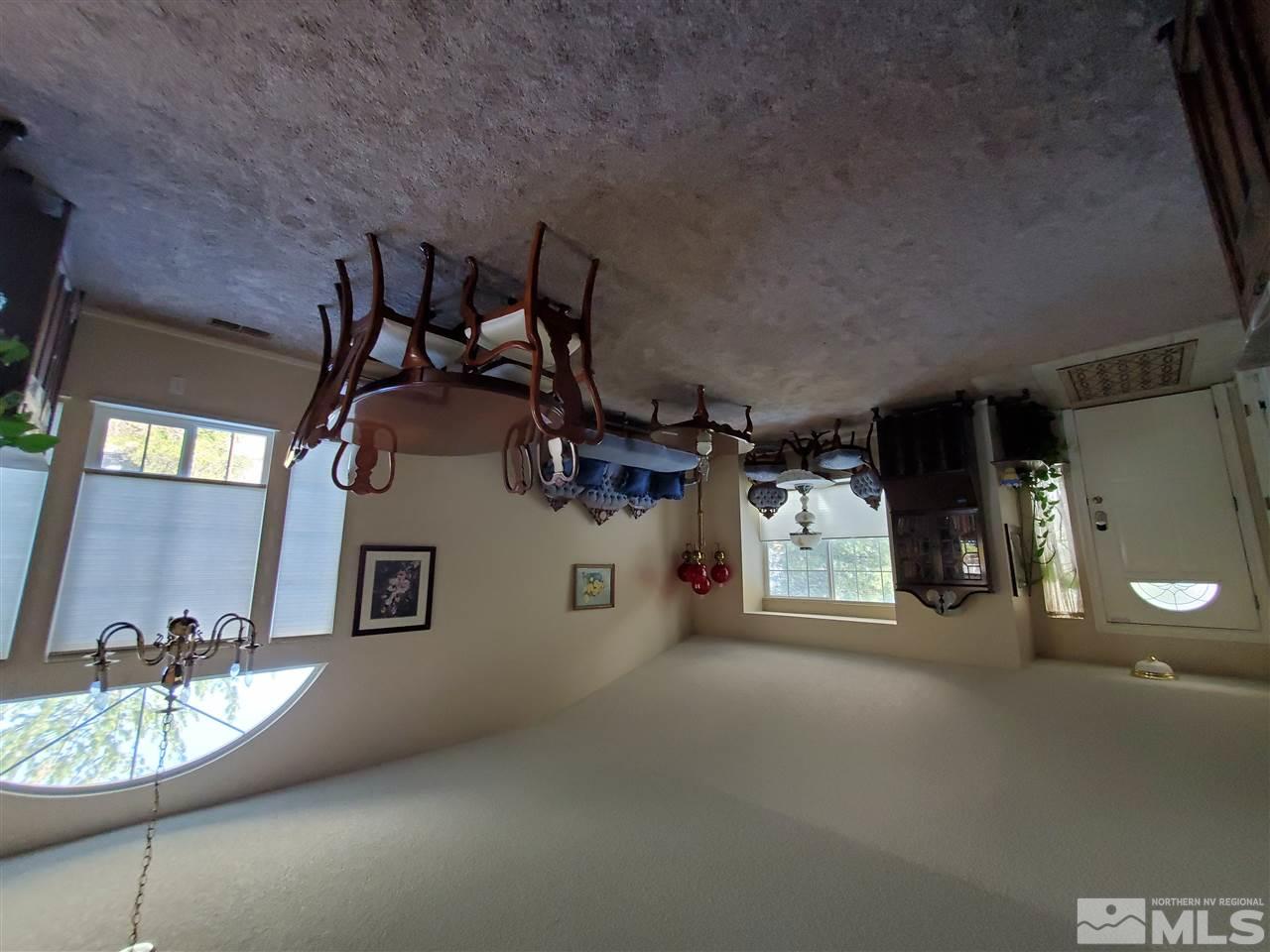 5299 Simons Drive Reno, NV 89523 - Photo 3 of 29 a living room with furniture and a chandelier