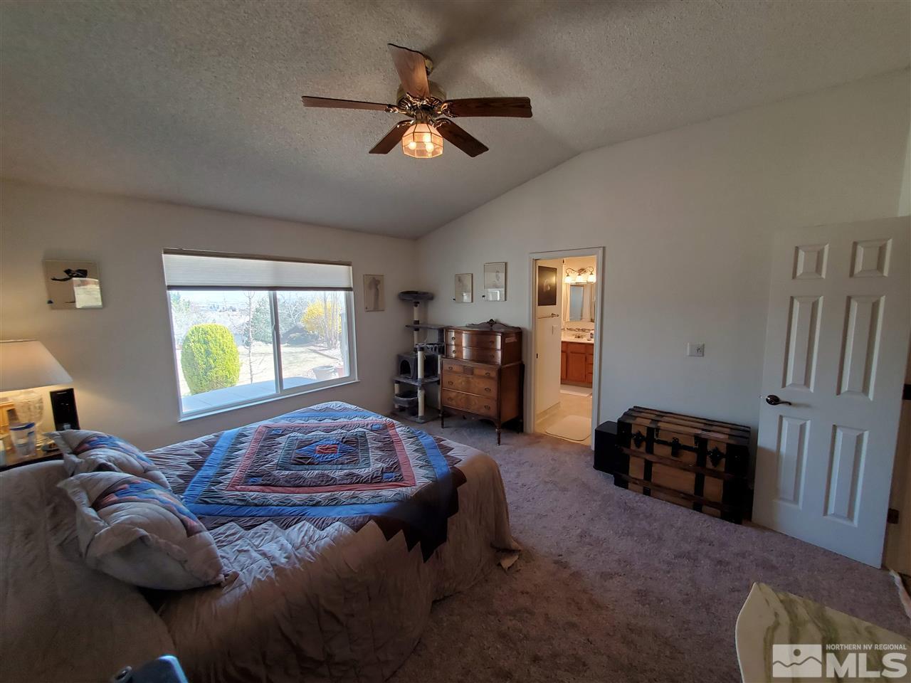 5299 Simons Drive Reno, NV 89523 - Photo 10 of 29 a bedroom with a bed and window