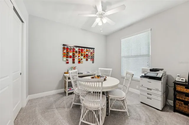 a kitchen that has a sink a stove and cabinets