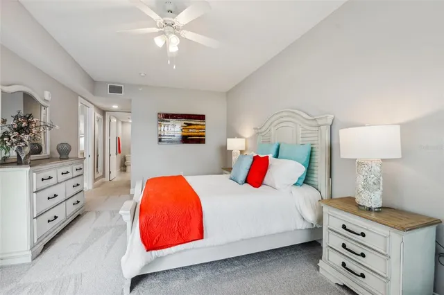 a spacious bathroom with a granite countertop sink a toilet and a shower