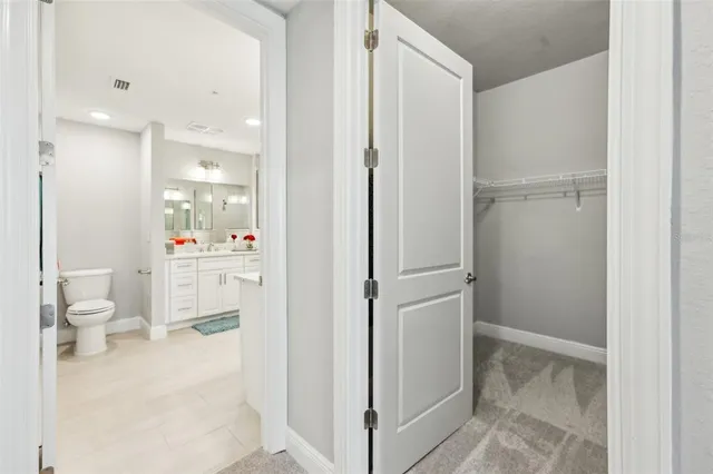 a bathroom with a sink vanity and a mirror