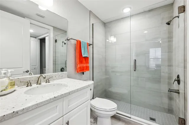 an aerial view of a house with a swimming pool and outdoor space