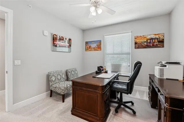 a view of a backyard with sitting area