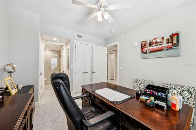 a view of a patio with couches table and chairs and potted plants