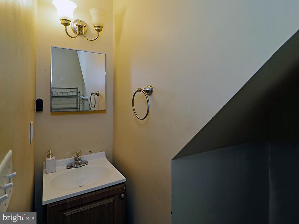 305 West 8th Street Bethlehem, PA 18015 - Photo 21 of 28 Cozy half-bath under the stairs.
