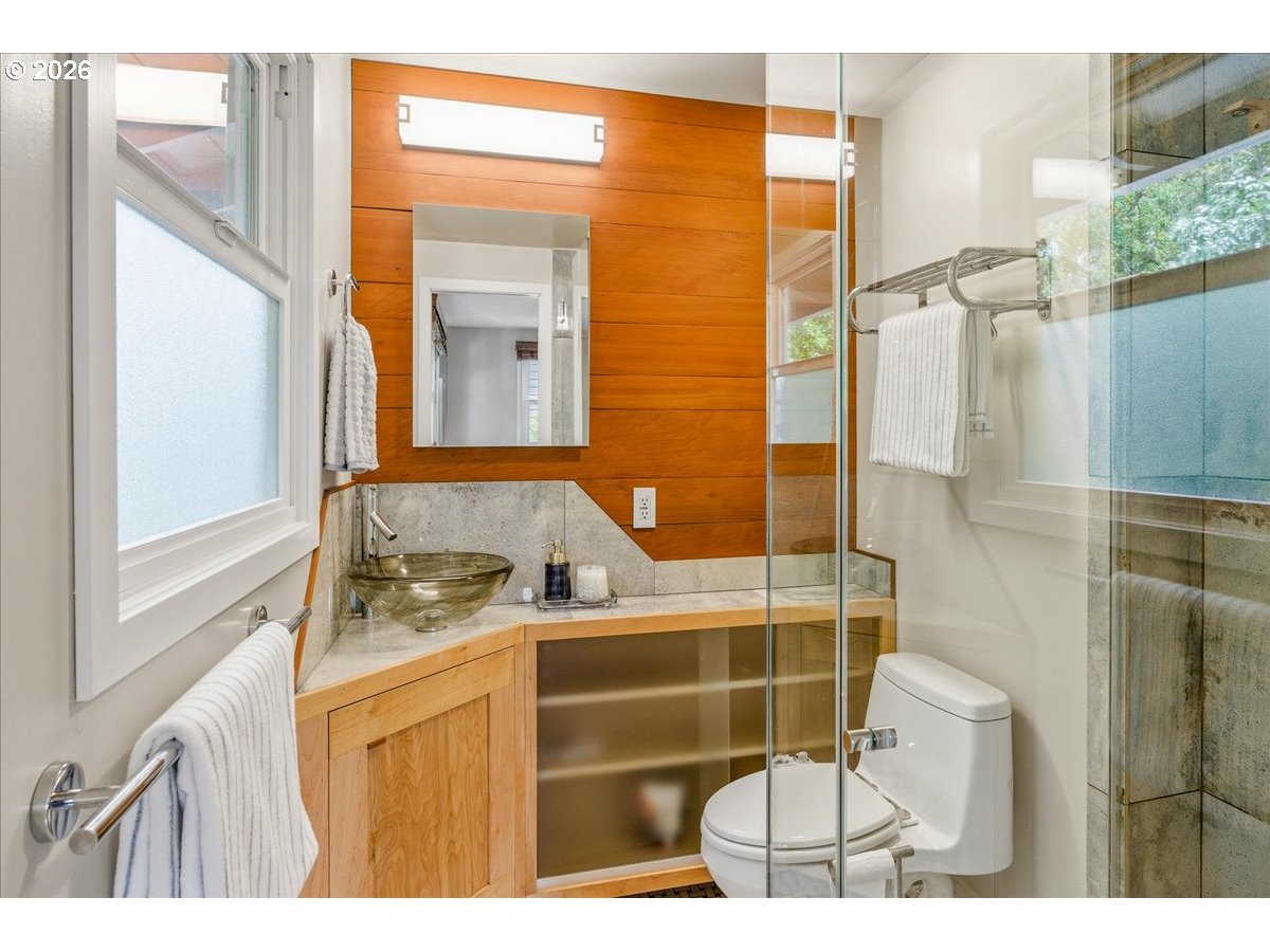 3130 Southwest 116th Avenue Beaverton, OR 97005 - Photo 11 of 44 a bathroom with a sink toilet a mirror and shower