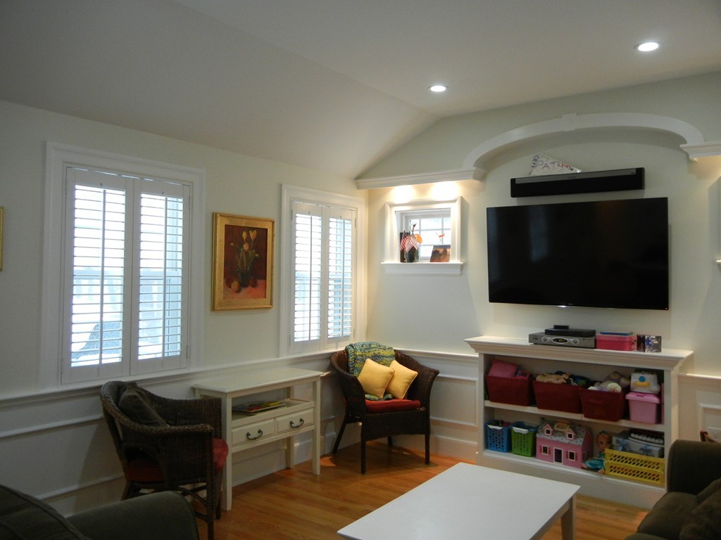 12 Calvert Road Walpole, MA 02032 - Photo 13 of 30 a living room with furniture and a flat screen tv