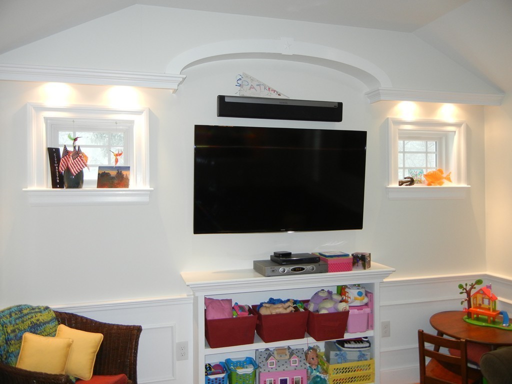 12 Calvert Road Walpole, MA 02032 - Photo 14 of 30 a living room with furniture and a flat screen tv