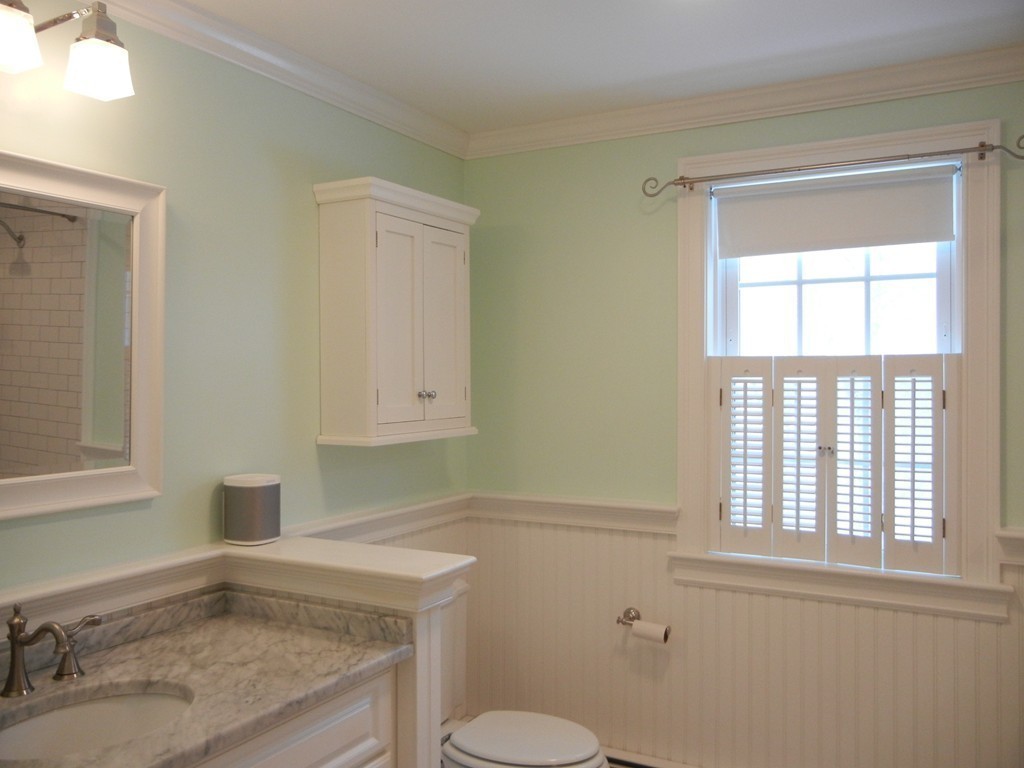 12 Calvert Road Walpole, MA 02032 - Photo 15 of 30 a bathroom with a granite countertop toilet sink and window