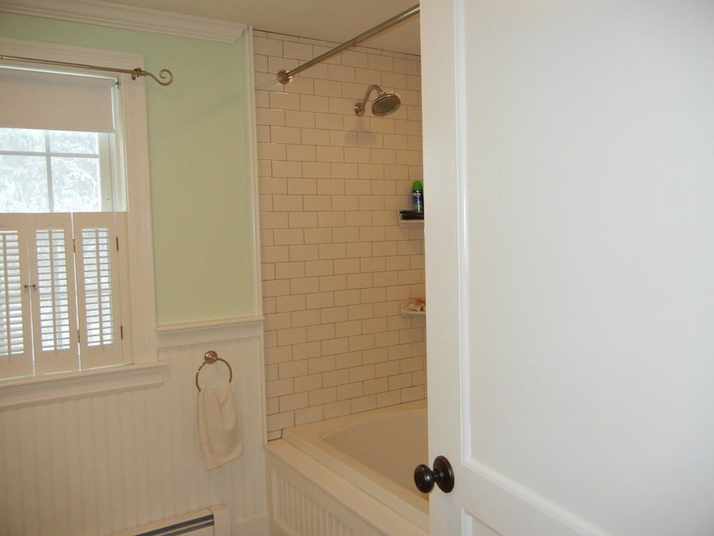 12 Calvert Road Walpole, MA 02032 - Photo 16 of 30 a bathroom with a shower and a window
