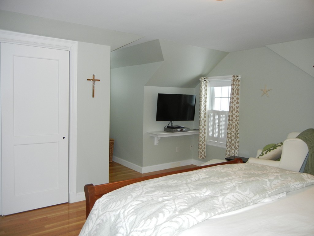 12 Calvert Road Walpole, MA 02032 - Photo 21 of 30 a bedroom with a bed and a flat screen tv