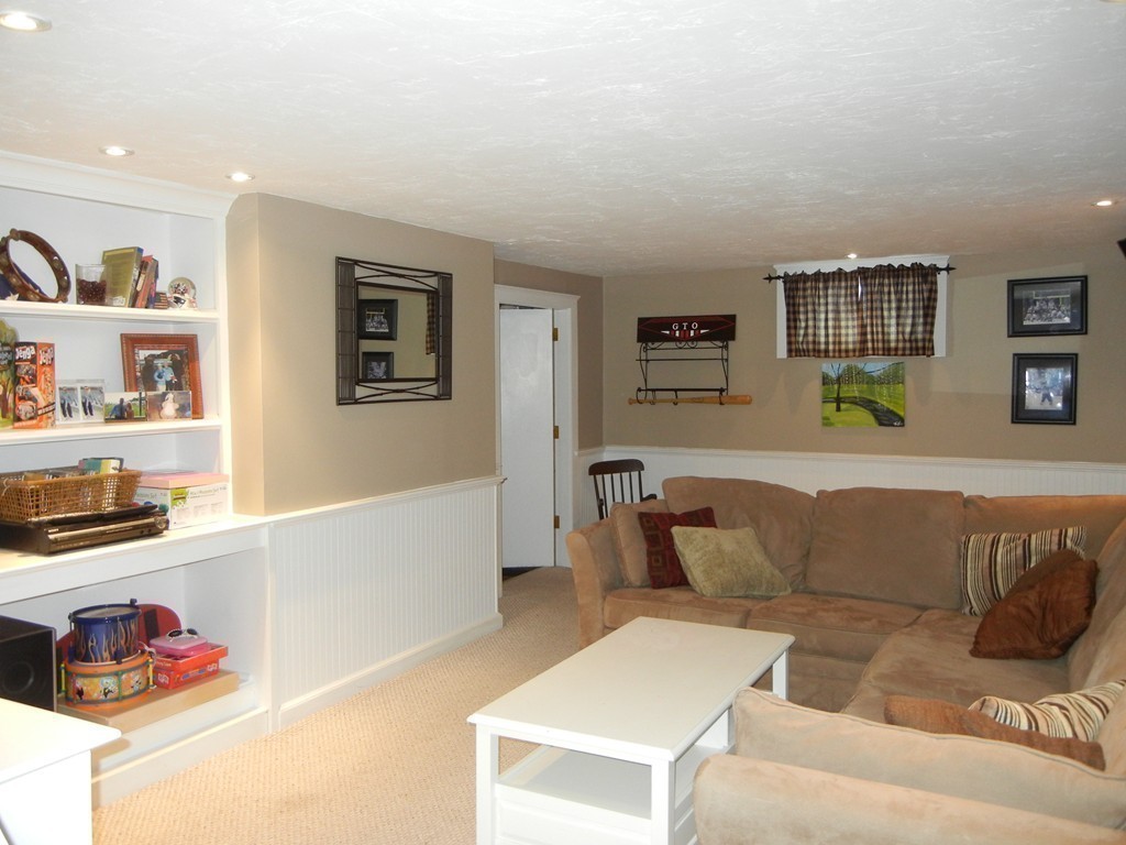 12 Calvert Road Walpole, MA 02032 - Photo 26 of 30 a living room with furniture and a wooden floor