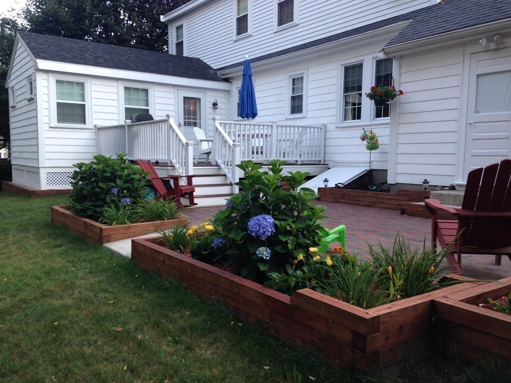 12 Calvert Road Walpole, MA 02032 - Photo 27 of 30 a front view of a house with a garden