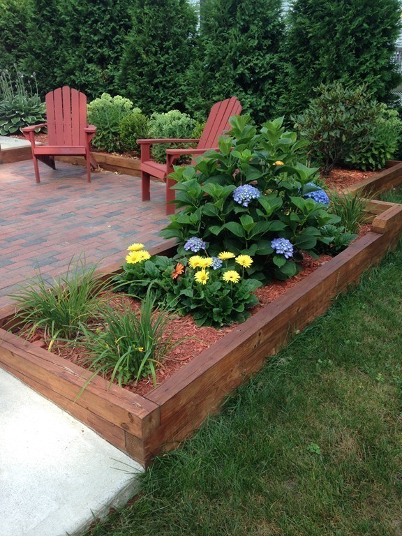 12 Calvert Road Walpole, MA 02032 - Photo 28 of 30 a garden view with a seating space