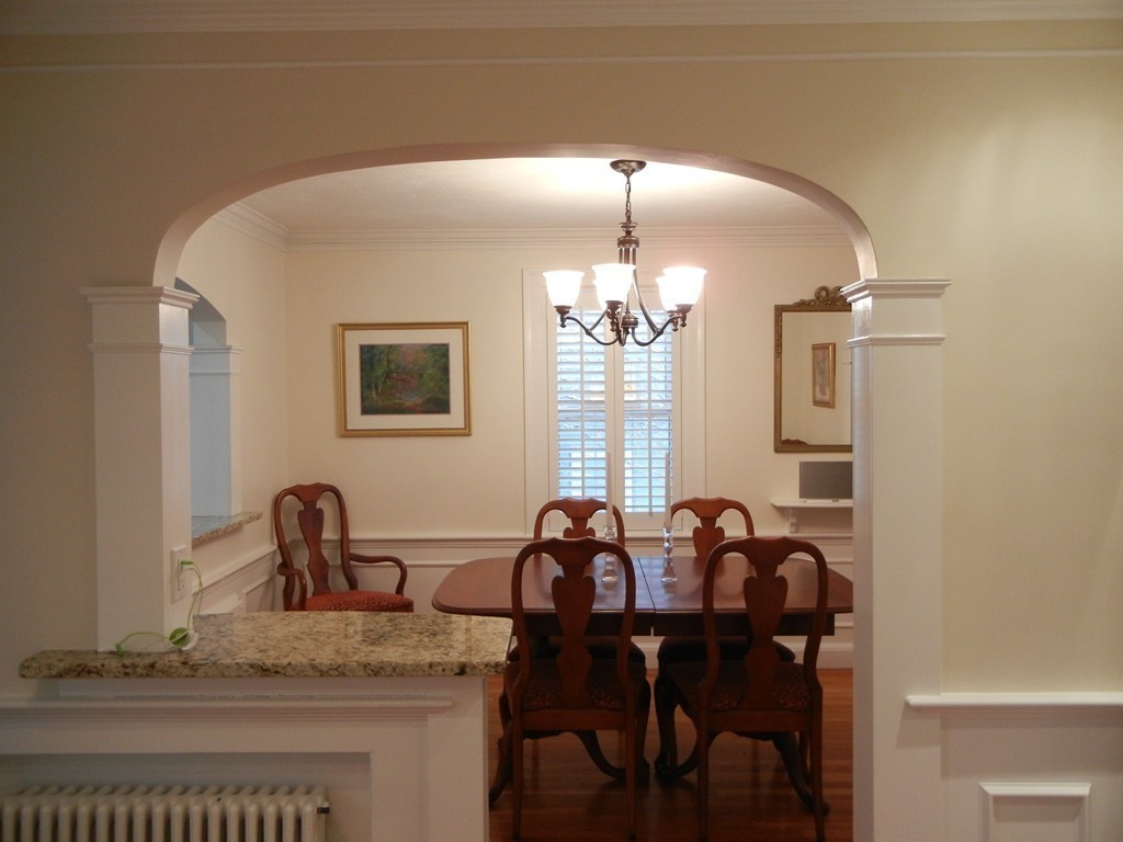 12 Calvert Road Walpole, MA 02032 - Photo 6 of 30 a view of a dining room with furniture and chandelier