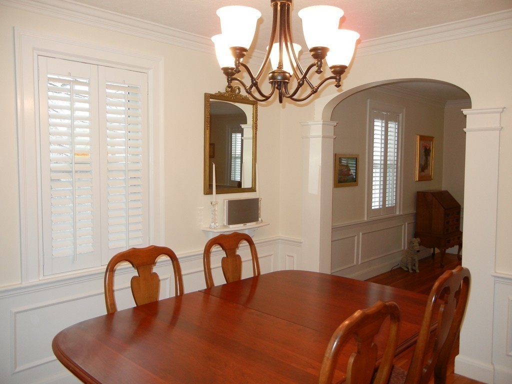 12 Calvert Road Walpole, MA 02032 - Photo 7 of 30 a view of a dining room with furniture and chandelier