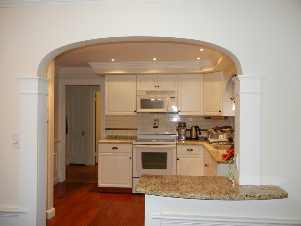 12 Calvert Road Walpole, MA 02032 - Photo 10 of 30 a kitchen with stainless steel appliances granite countertop a stove and a refrigerator
