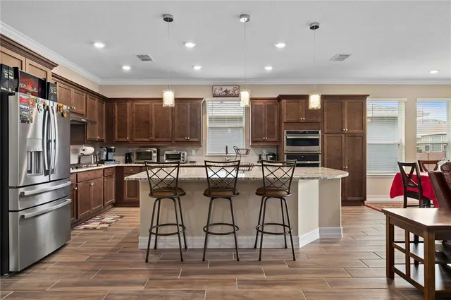 a view of a dining room with furniture window and outside view