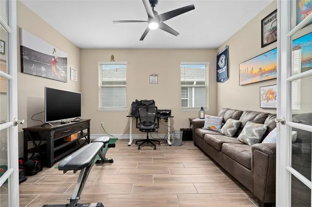 a living room with furniture and a flat screen tv
