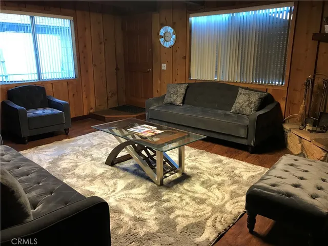 a living room with furniture and a rug