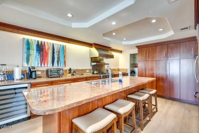 a large counter top space with a large window