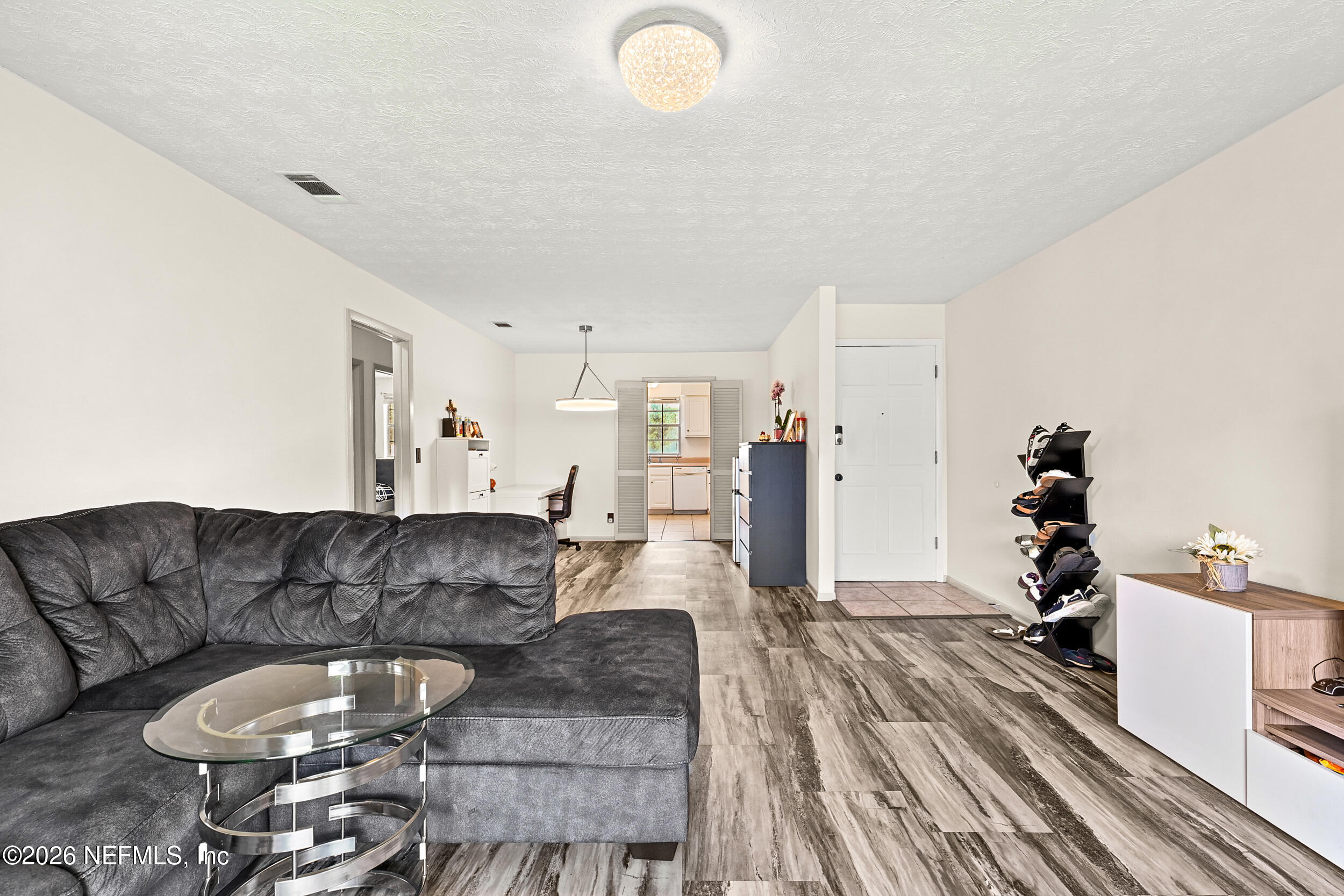 4915 Baymeadows Road, Unit 6G Jacksonville, FL 32217 - Photo 9 of 44 a living room with furniture and a couch