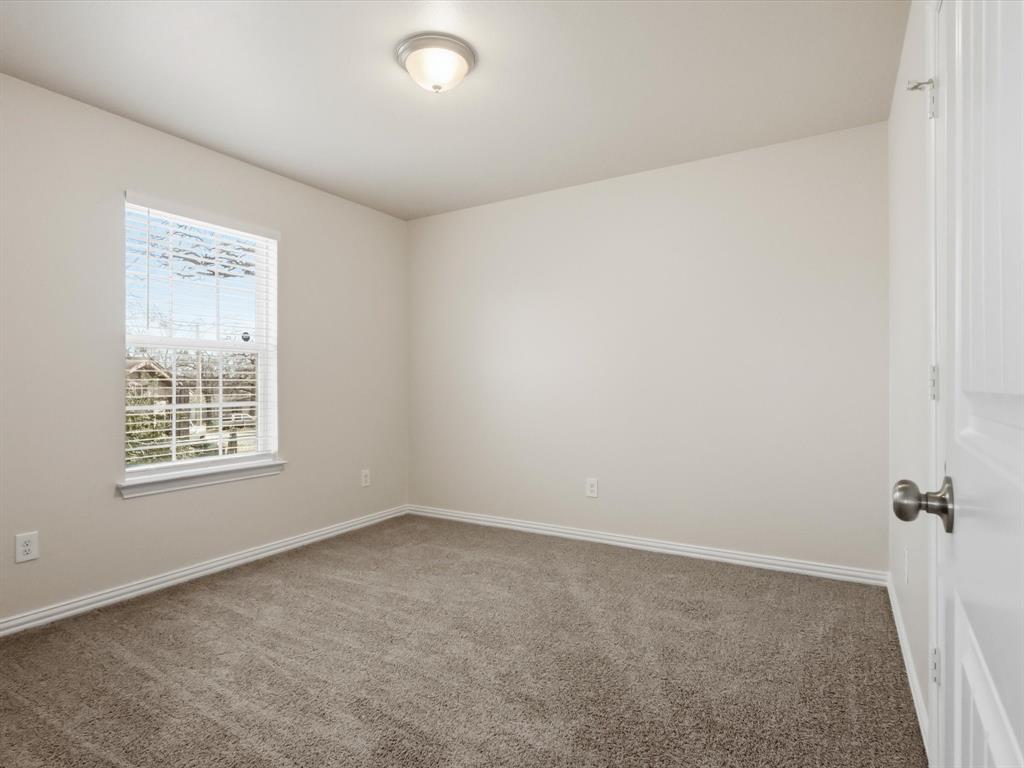 6409 Ramey Avenue Fort Worth, TX 76112 - Photo 23 of 25 an empty room with a window