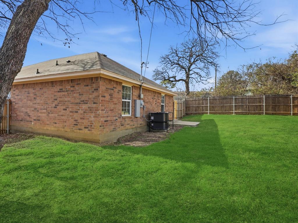 6409 Ramey Avenue Fort Worth, TX 76112 - Photo 24 of 25 a view of a back yard of the house