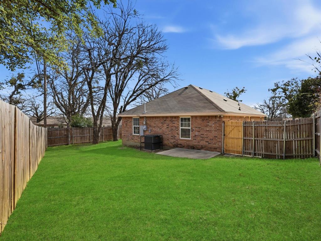 6409 Ramey Avenue Fort Worth, TX 76112 - Photo 25 of 25 a view of a yard in front of a house