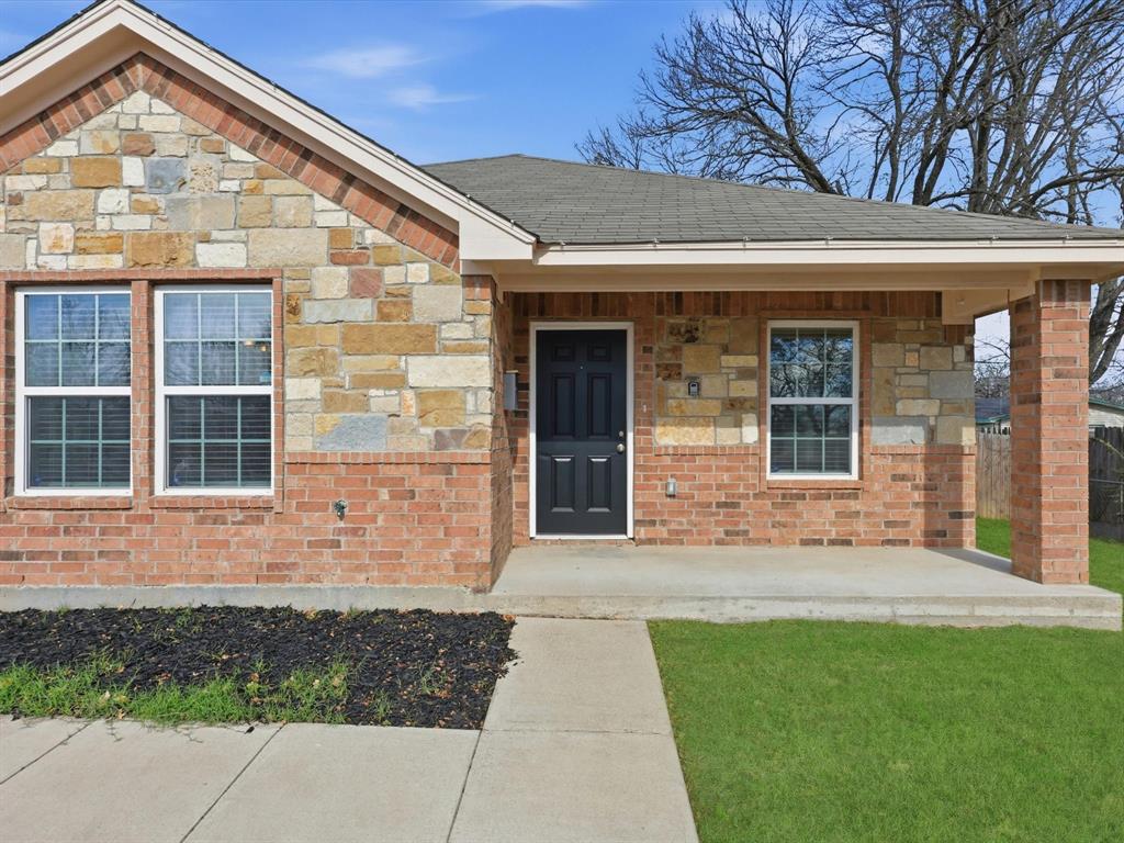6409 Ramey Avenue Fort Worth, TX 76112 - Photo 4 of 25 a front view of a house with a yard