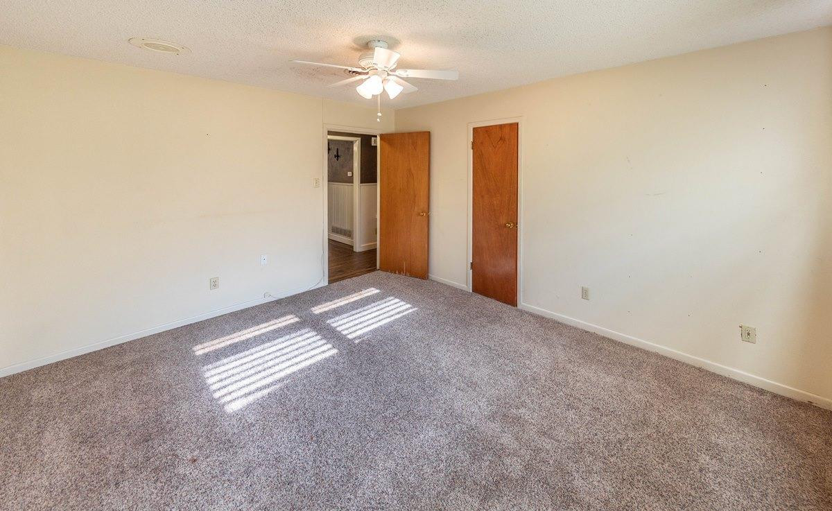 5415 8th Street Lubbock, TX 79416 - Photo 11 of 27 a view of empty room with ceiling fan