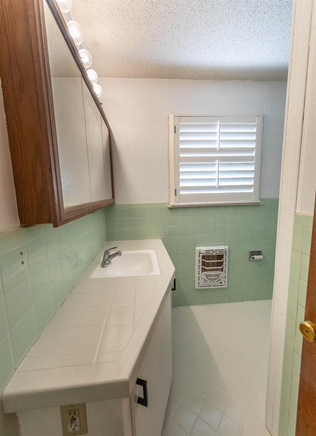 5415 8th Street Lubbock, TX 79416 - Photo 20 of 27 a bathroom with a sink and a bathtub