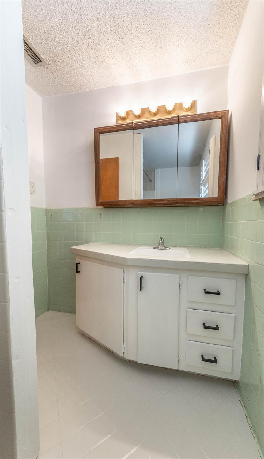 5415 8th Street Lubbock, TX 79416 - Photo 22 of 27 a utility room with a sink