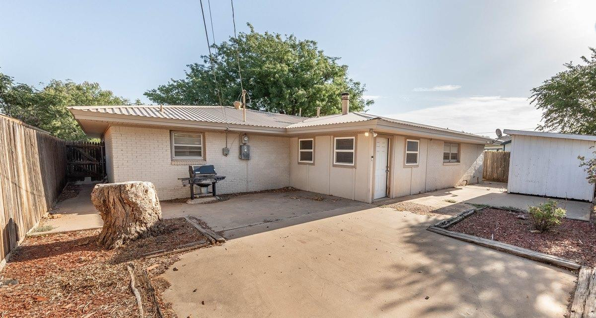 5415 8th Street Lubbock, TX 79416 - Photo 27 of 27 a backyard of a house with table and chairs