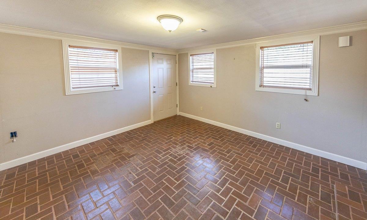 5415 8th Street Lubbock, TX 79416 - Photo 6 of 27 a view of an empty room and window