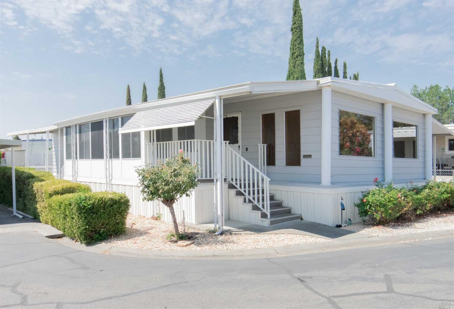 4 Lemon Tree Circle, Unit 4 Vacaville, CA 95687 - Photo 1 of 1 a front view of a house with a yard and potted plants