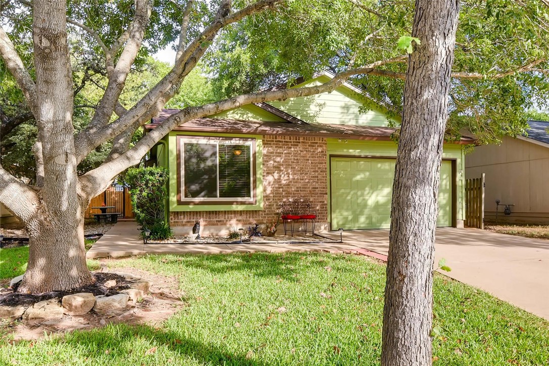 8102 Treehouse Lane Austin, TX 78749 - Photo 1 of 1 a front view of a house with garden