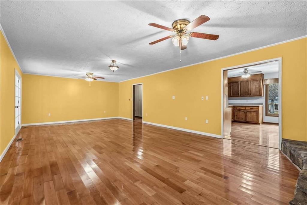 202 Ridgewood Road Cedartown, GA 30125 - Photo 20 of 39 a view of an empty room with a window and wooden floor