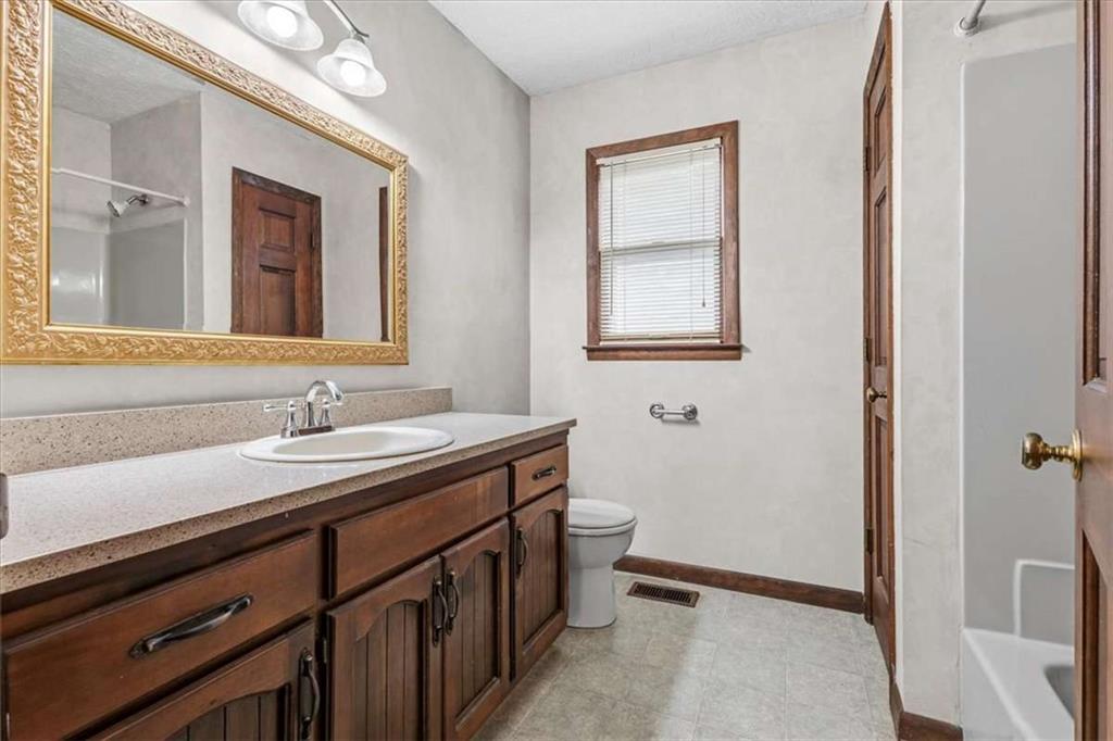 202 Ridgewood Road Cedartown, GA 30125 - Photo 32 of 39 a bathroom with a sink a toilet and a mirror