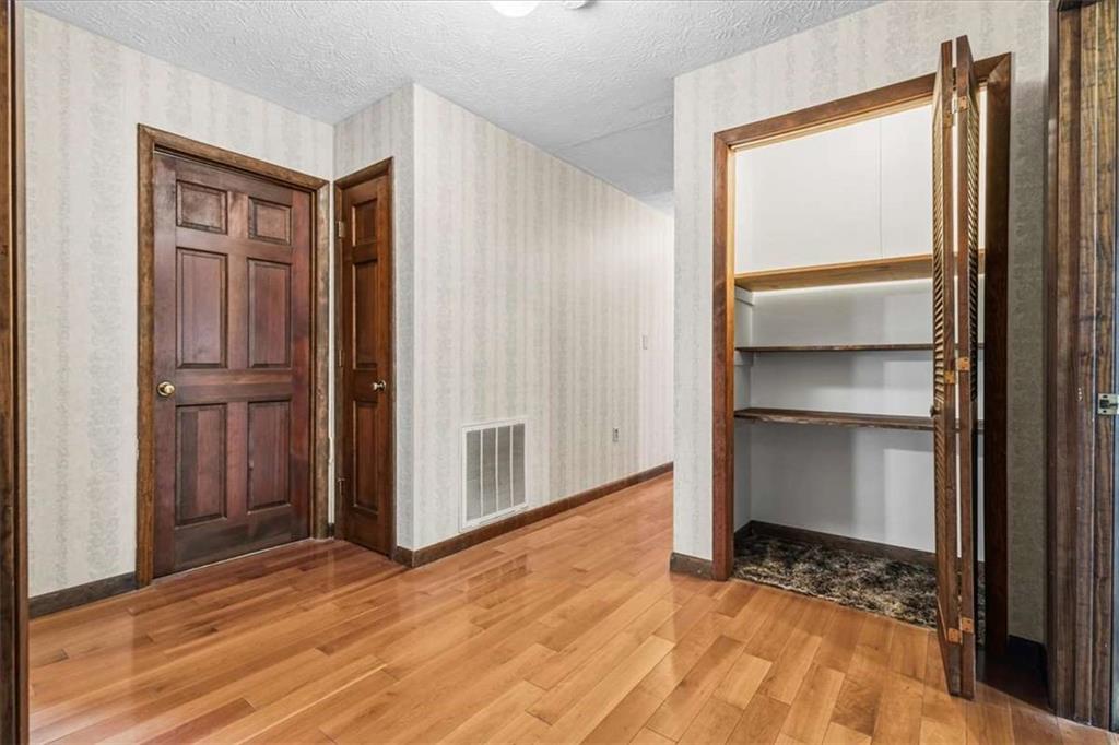 202 Ridgewood Road Cedartown, GA 30125 - Photo 34 of 39 a view of an empty room with wooden floor and a window
