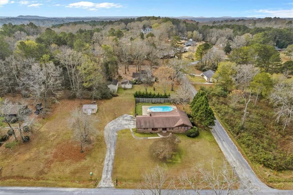 202 Ridgewood Road Cedartown, GA 30125 - Photo 8 of 39 a view of a swimming pool with a yard