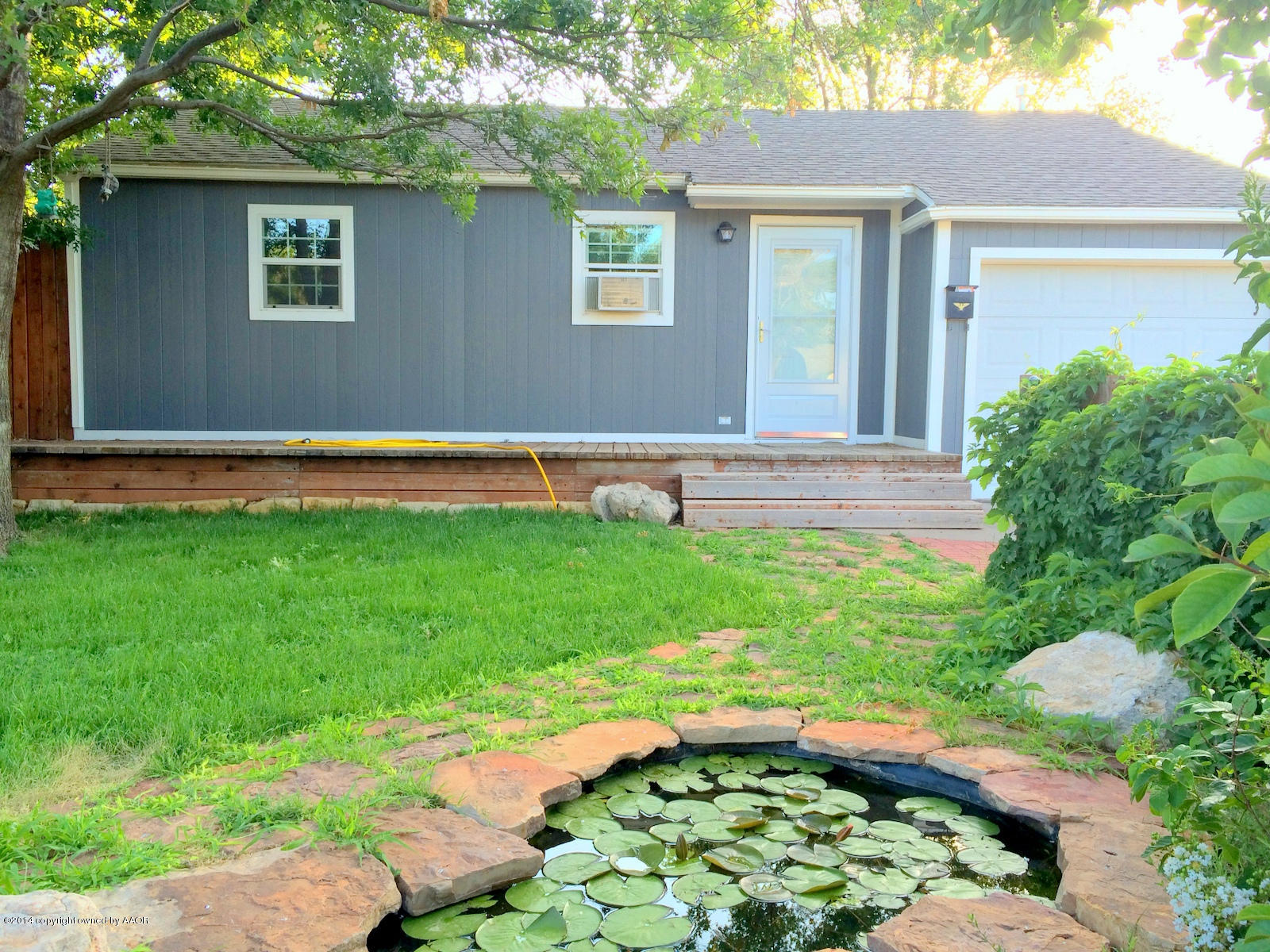 4208 South Hughes Street Amarillo, TX 79110 - Photo 1 of 16 a view of backyard with a patio and a yard