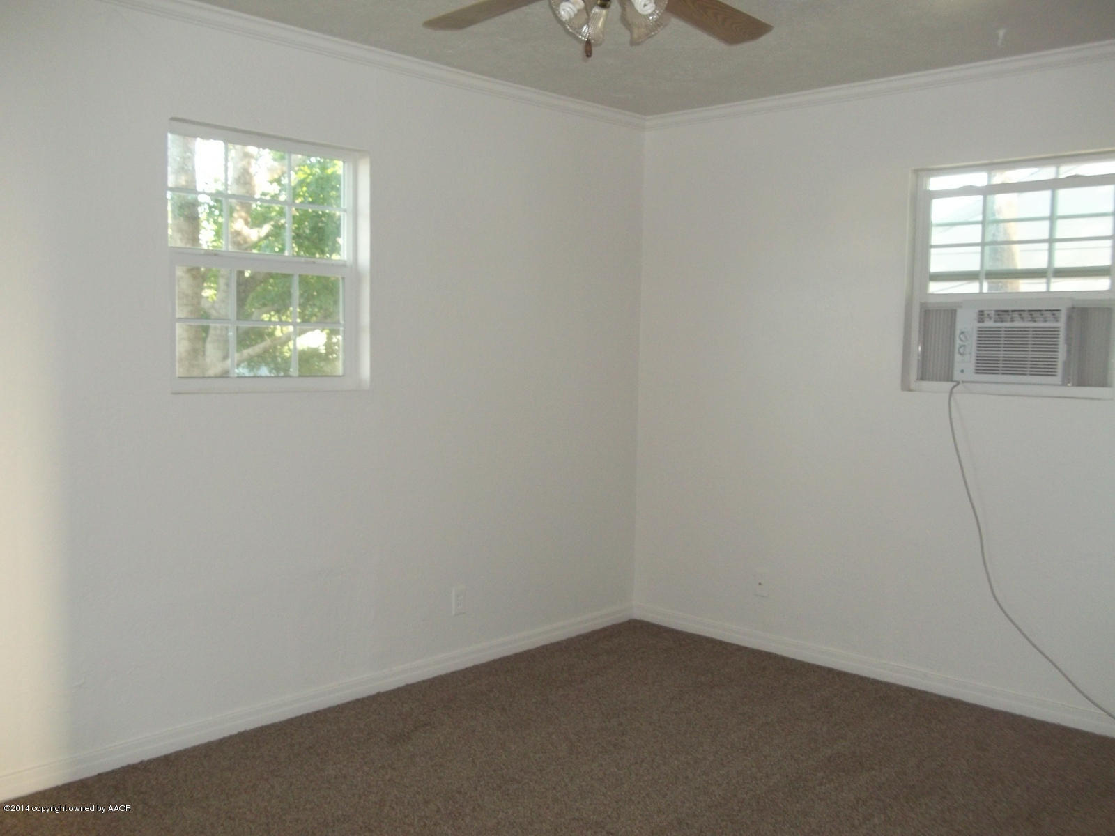 4208 South Hughes Street Amarillo, TX 79110 - Photo 7 of 16 an empty room with a window