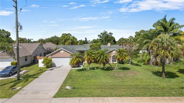 a view of multiple houses with yard