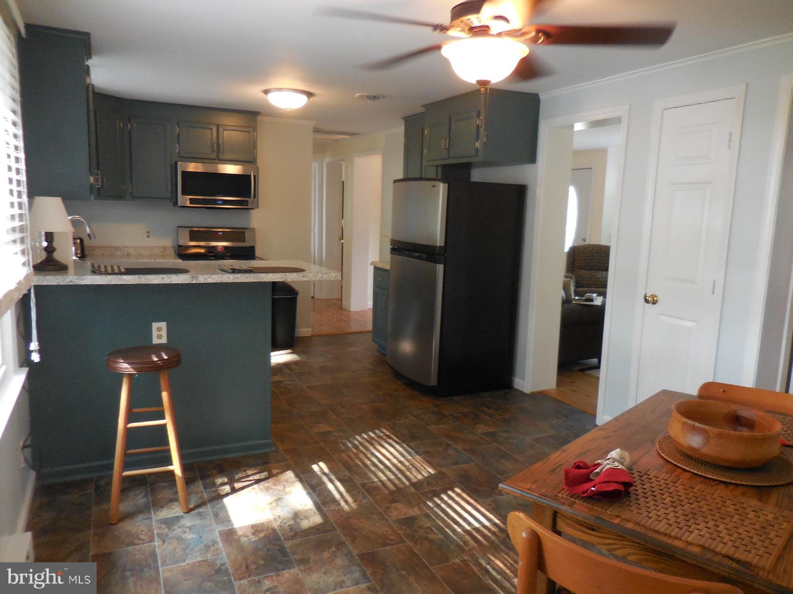 250 Outpost Road Luray, VA 22835 - Photo 16 of 25 a kitchen with stainless steel appliances granite countertop a refrigerator and a sink