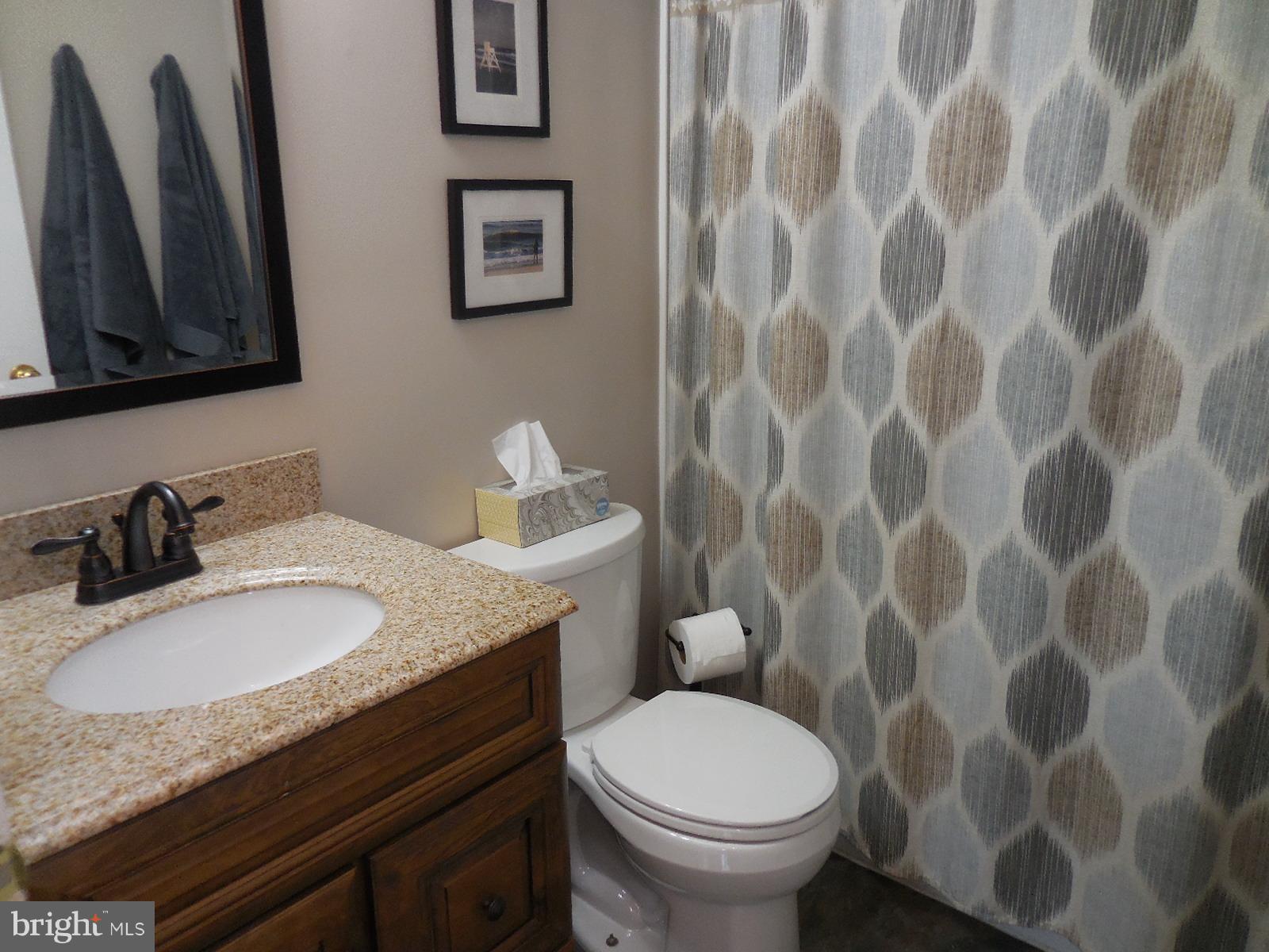 250 Outpost Road Luray, VA 22835 - Photo 23 of 25 a bathroom with a granite countertop sink and a mirror