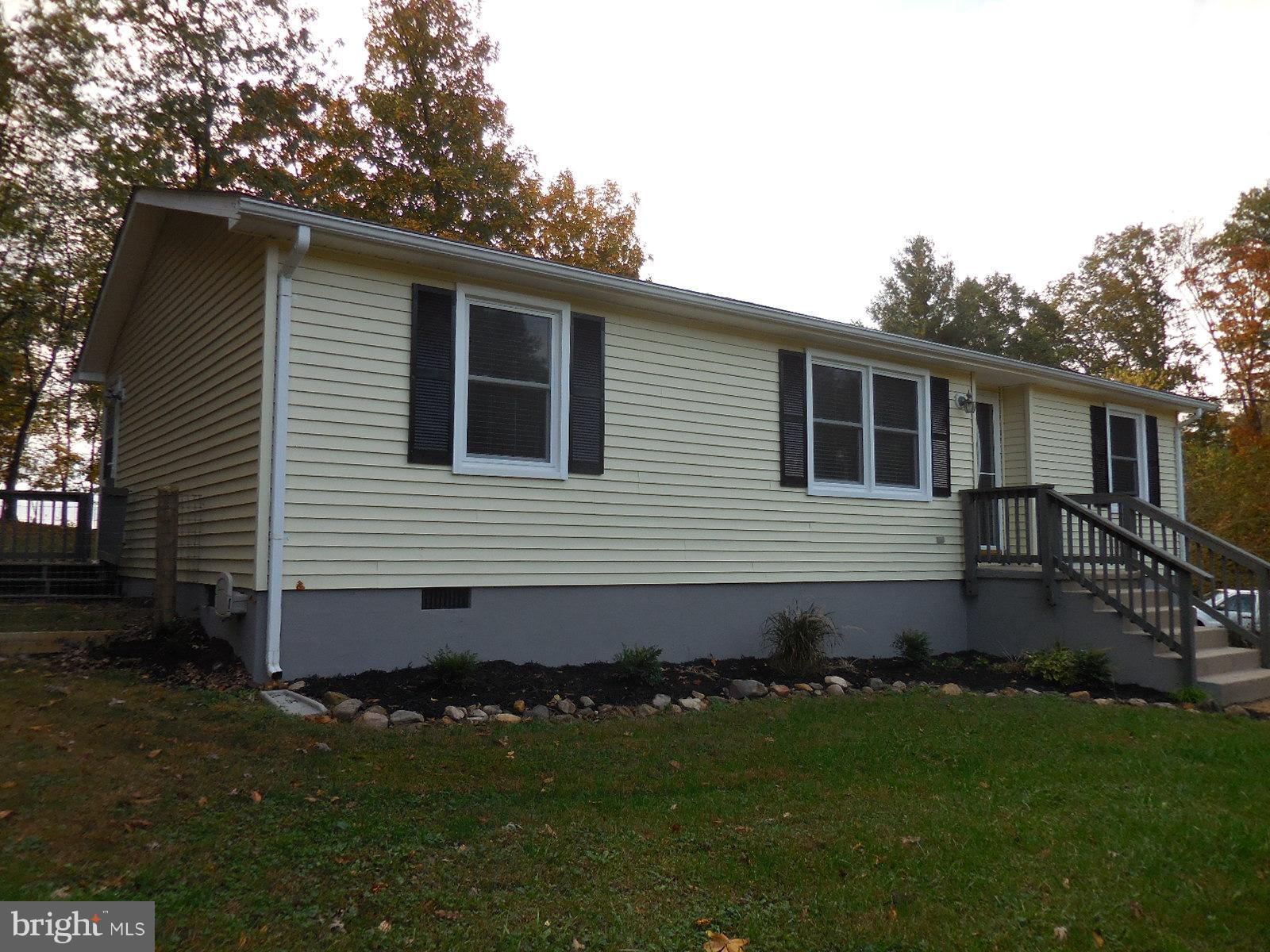 250 Outpost Road Luray, VA 22835 - Photo 3 of 25 a front view of a house with a garden