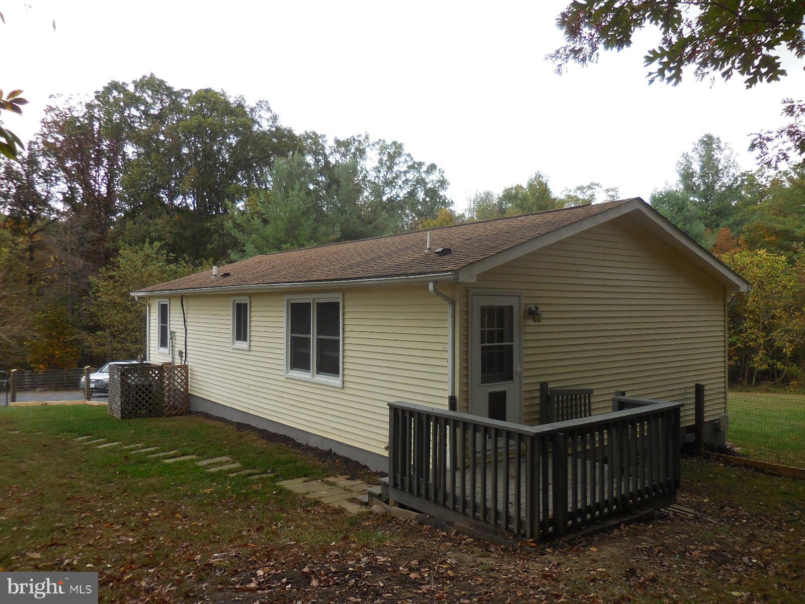 250 Outpost Road Luray, VA 22835 - Photo 4 of 25 a view of a house with yard and a garden